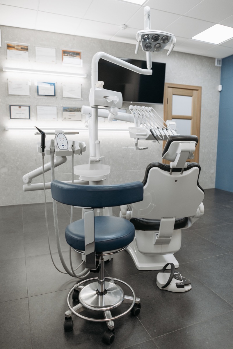 Dental operatory with a patient chair and overhead light